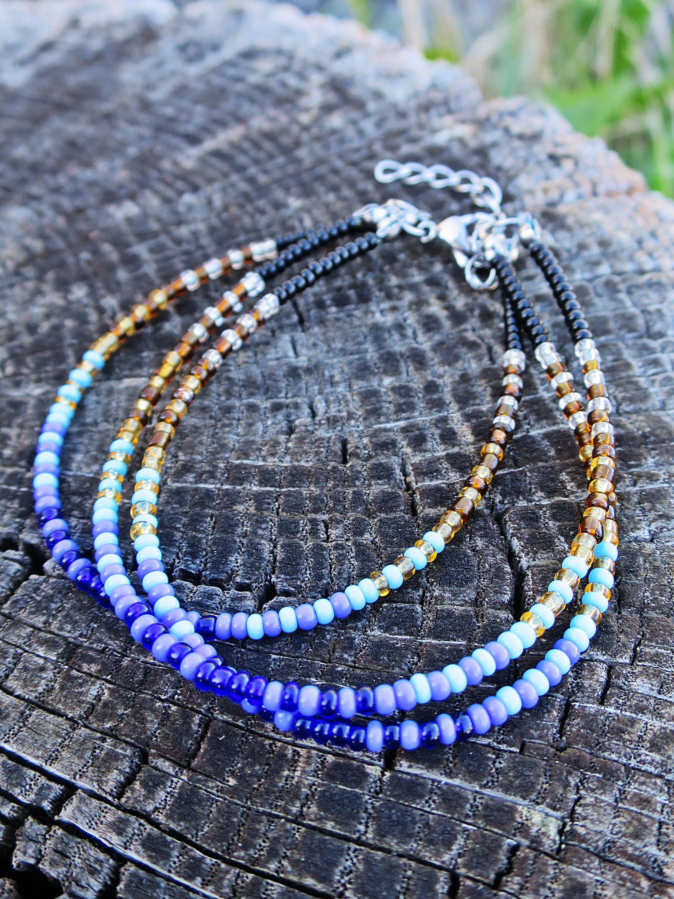 Sett - Mermaid Tails øreanheng og armbånd i turkis, blå, gull og svart (påfugl)