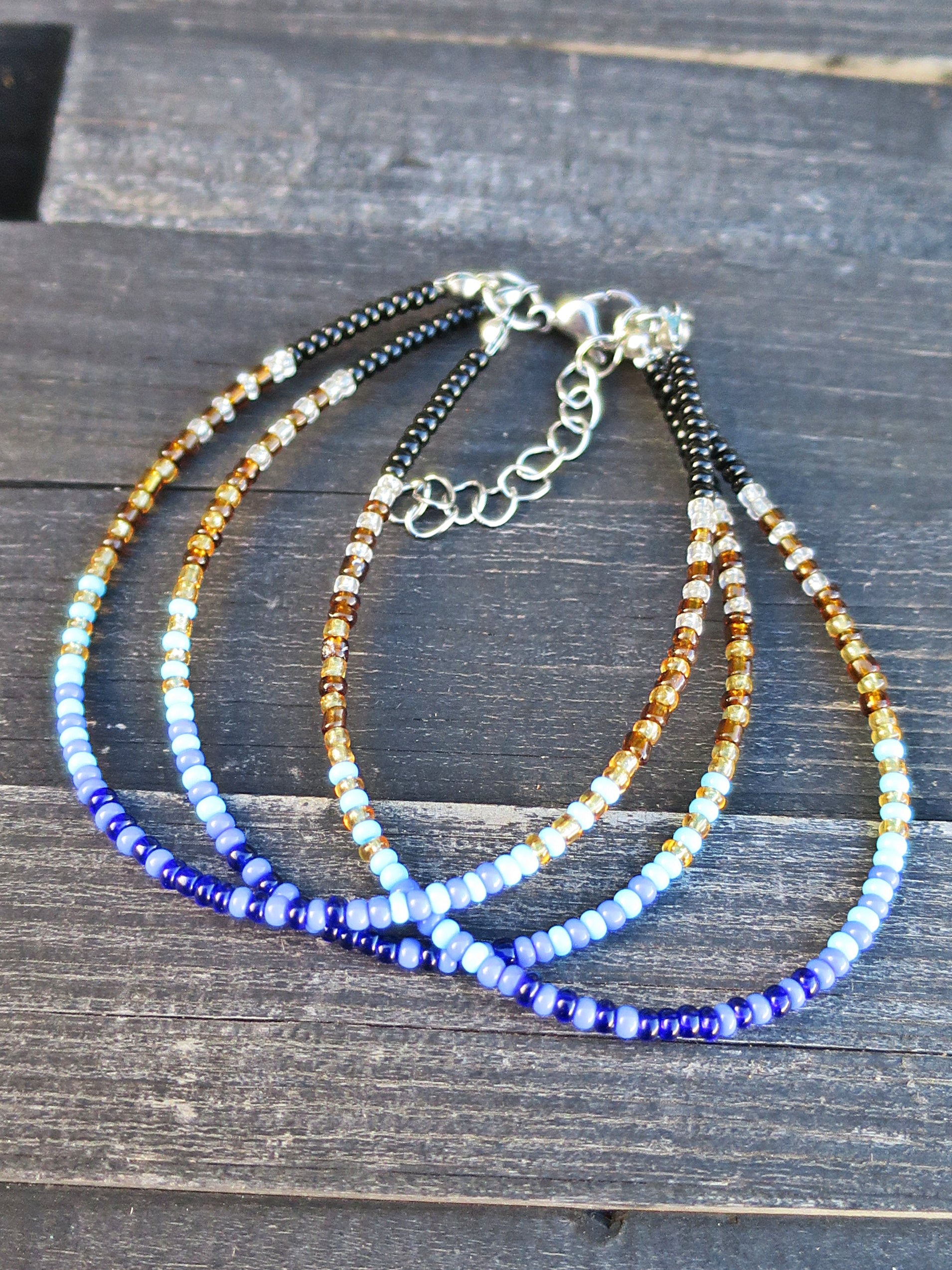 Mermaid - Armbånd i blå,turkis,gull og sort (påfugl)